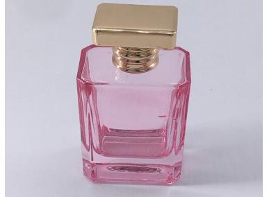 frasco de perfume rosa vazio